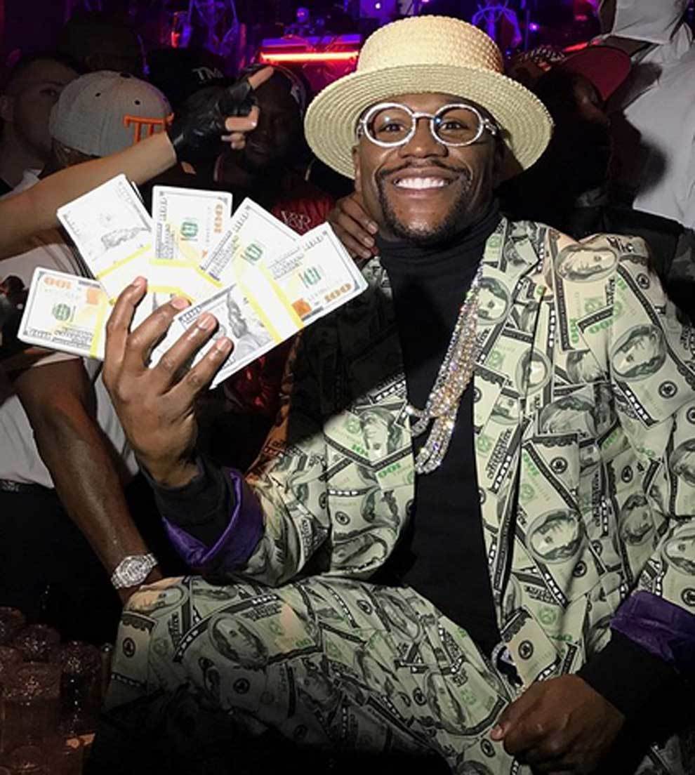 Floyd Mayweather posando con dinero