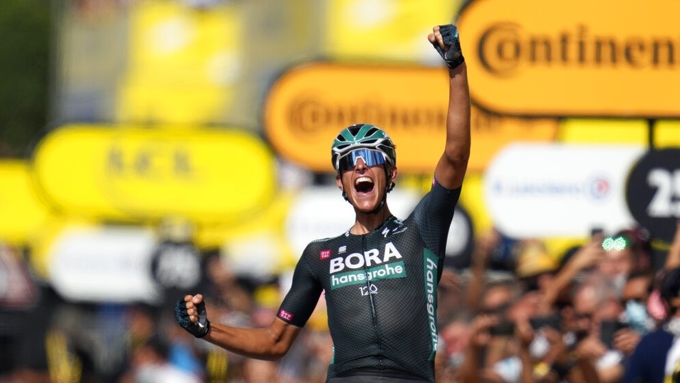 German Nils Politt celebrates as he crosses the finish line to win the twelfth stage of the Tour de France.