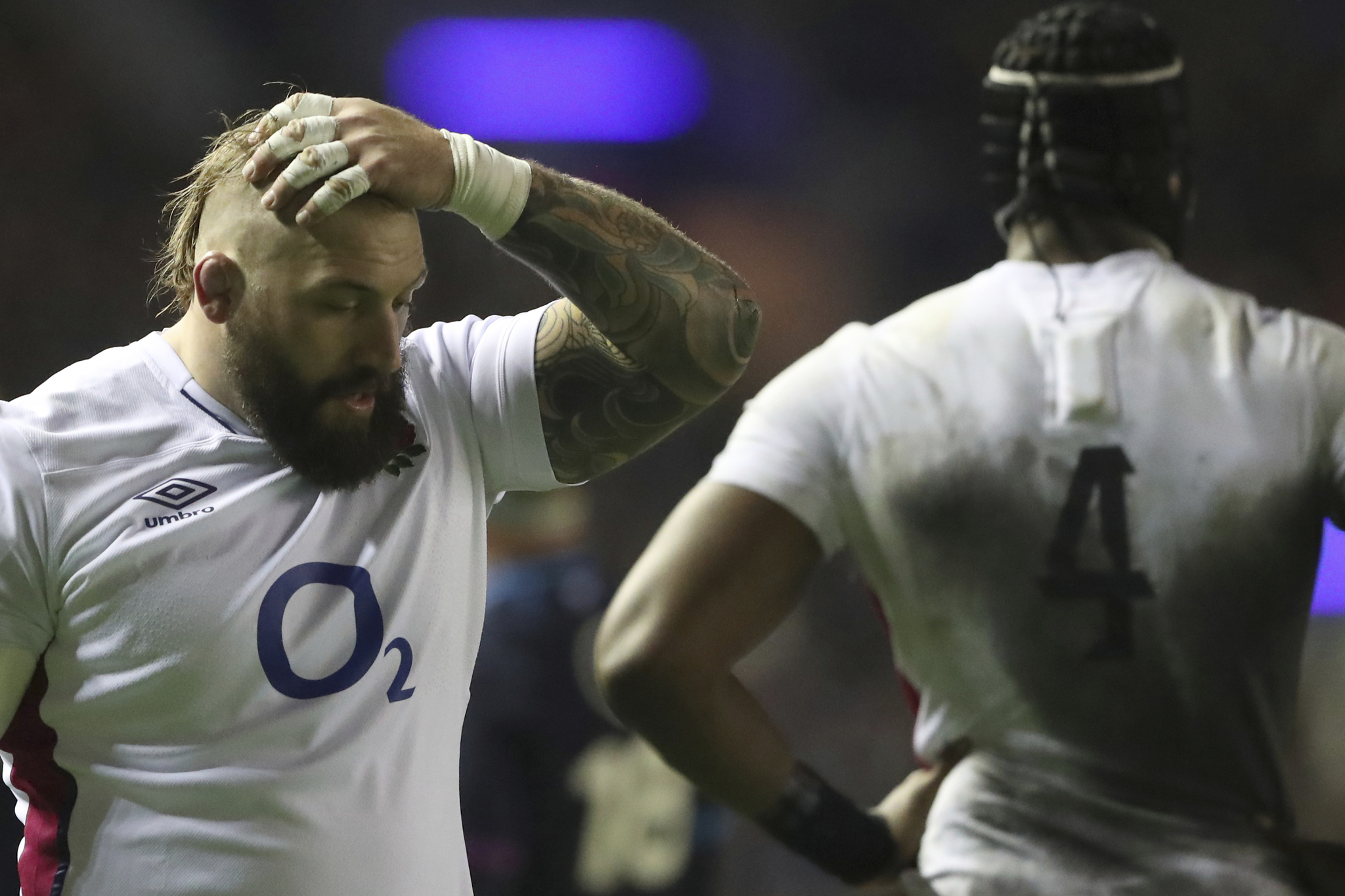 England's Joe Marler, left, reacts to a decision.