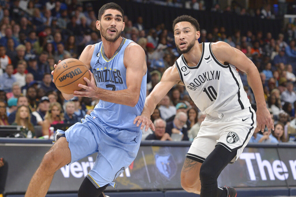 Memphis Grizzlies forward Santi Aldama (7) handles the ball against Brooklyn Nets guard Ben Simmons (10) in the second half of an NBA basketball game Monday, Oct. 24, 2022, in Memphis, Tenn.