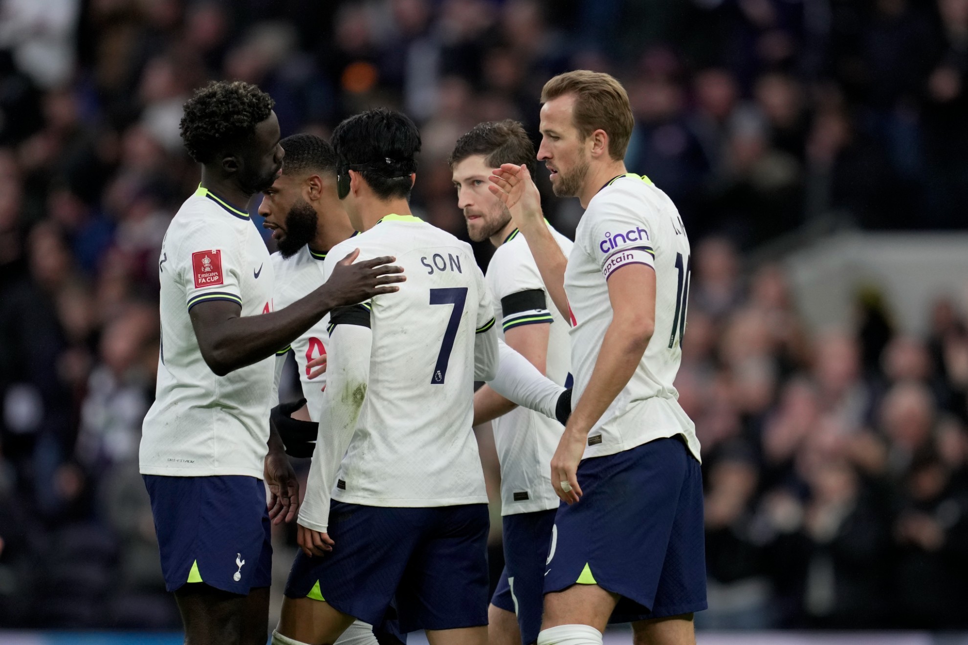 Tottenhams Harry Kane celebrates with teammates after scoring his sides opening goal.