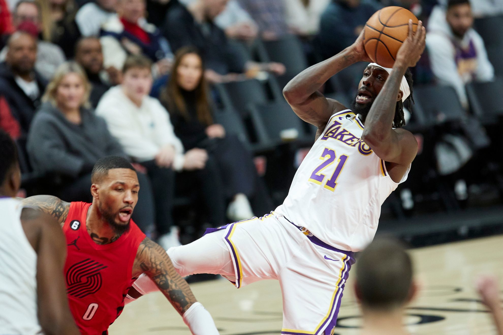 Damian Lillard (left) and Patrick Beverley (right) were talking trash all night long