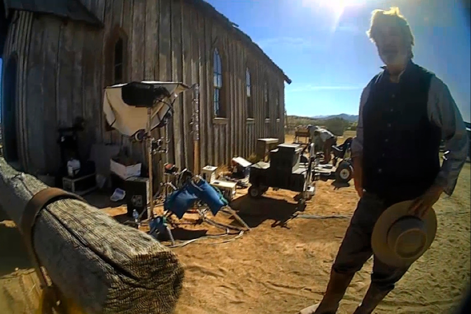 Alec Baldwin stands in costume and speaks with investigators following a fatal shooting on a movie set in Santa Fe