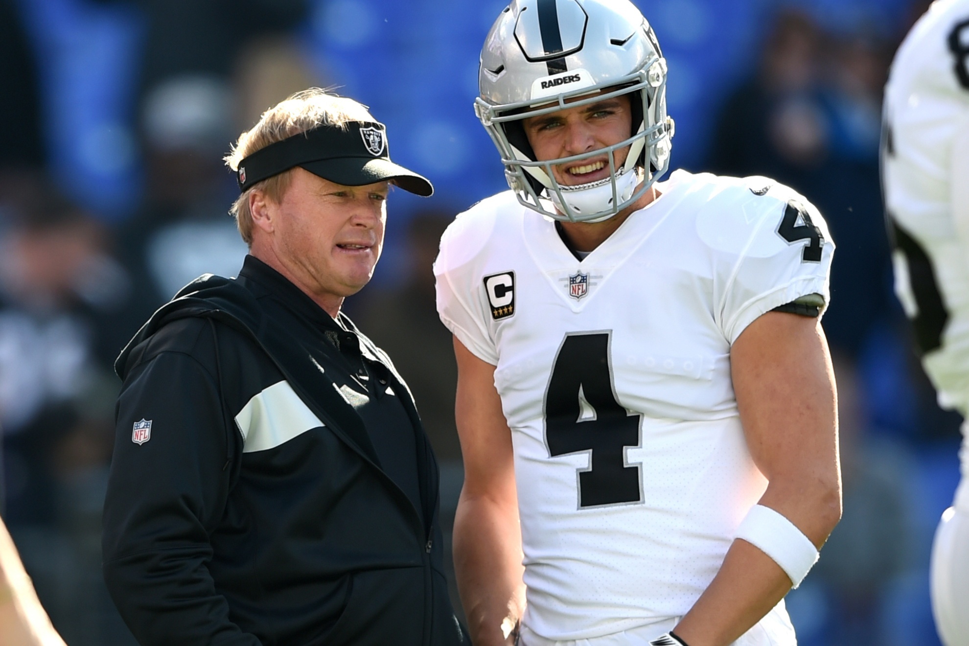 Former Raiders head coach Jon Gruden and QB Derek Carr.
