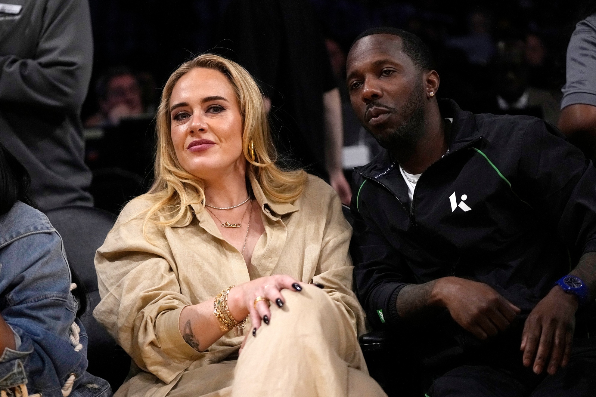 Adele with her husband during an NBA game.