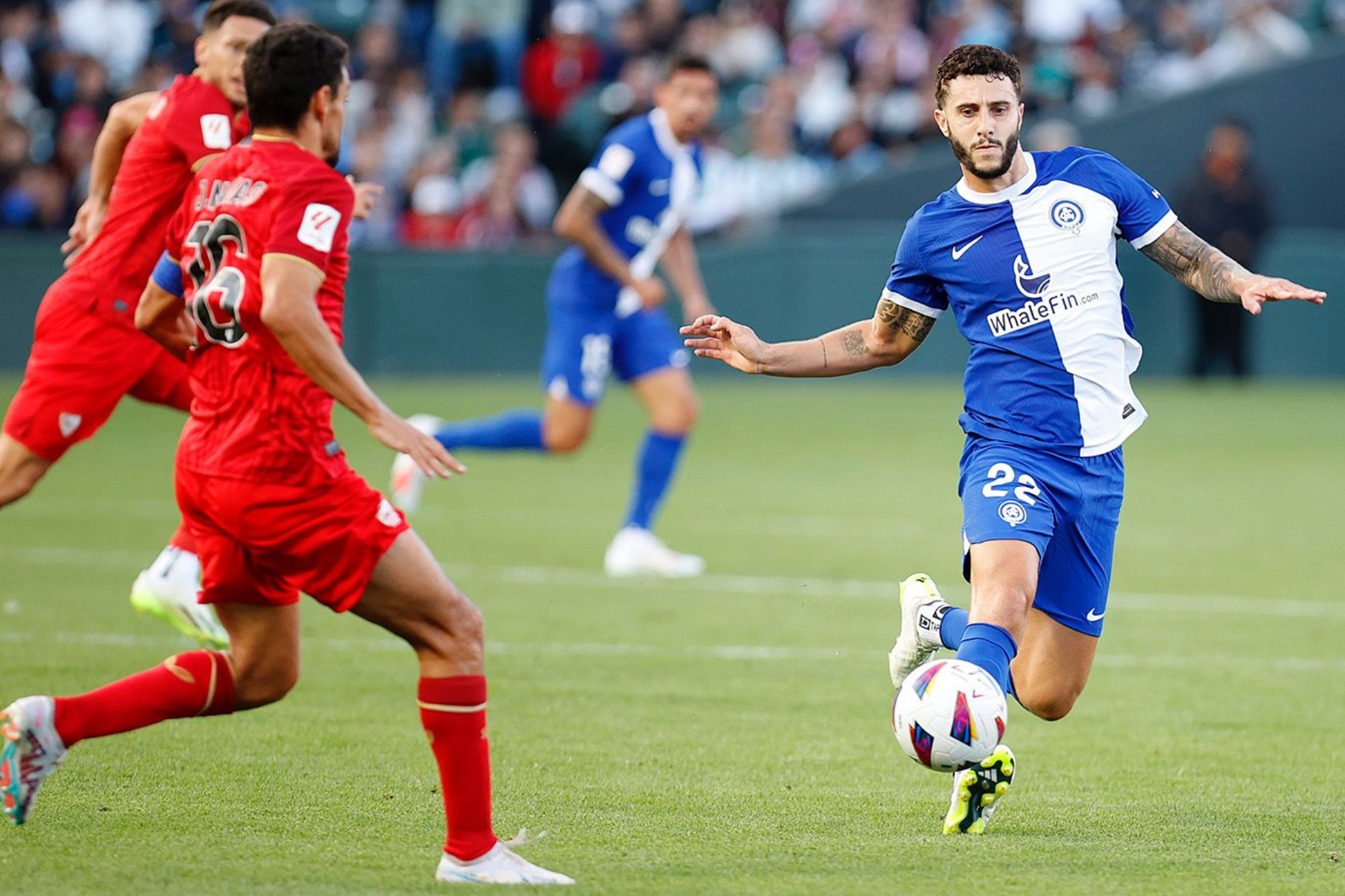 Mario Hermoso attempts to play the ball.
