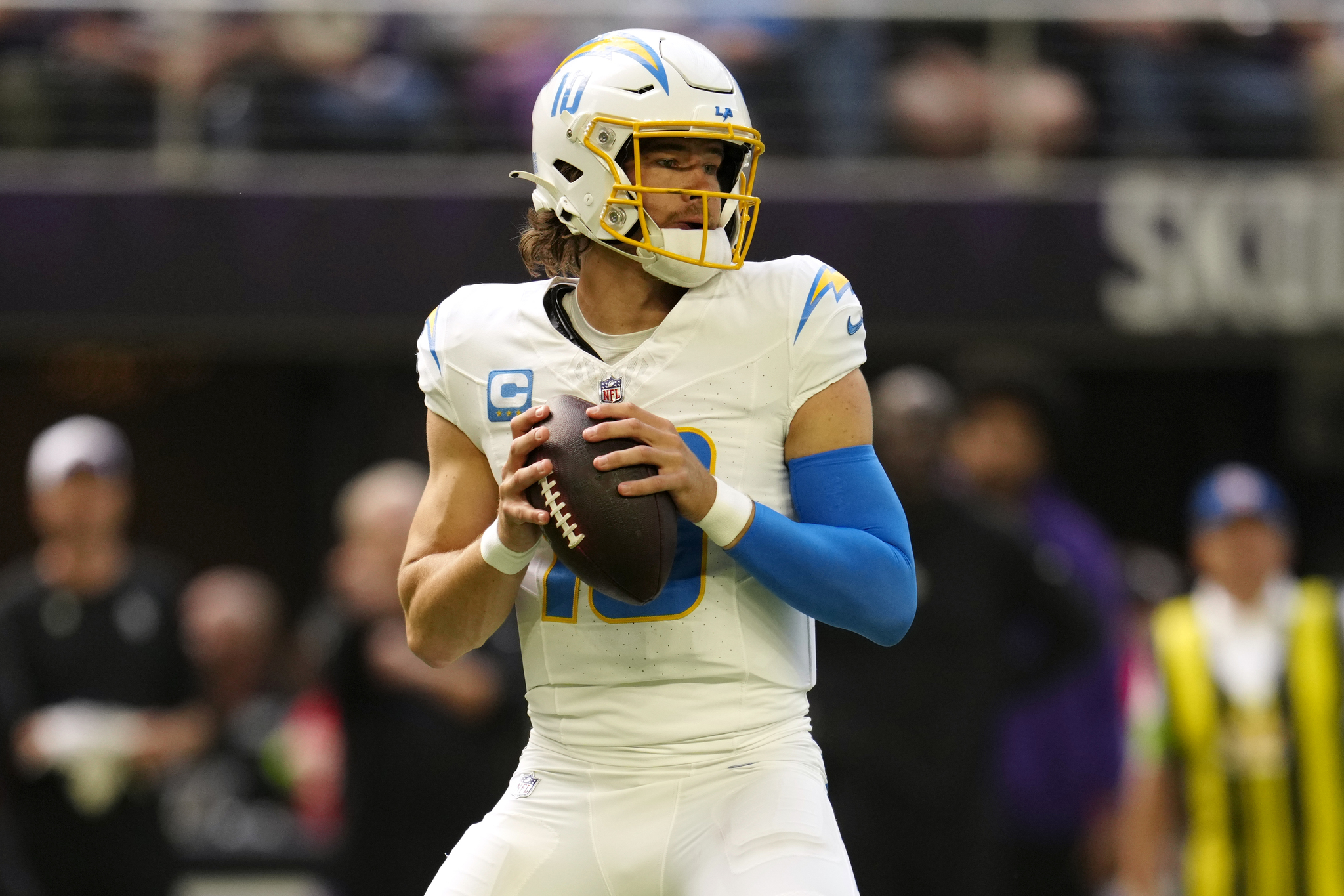 Justin Herbert drops back to pass.