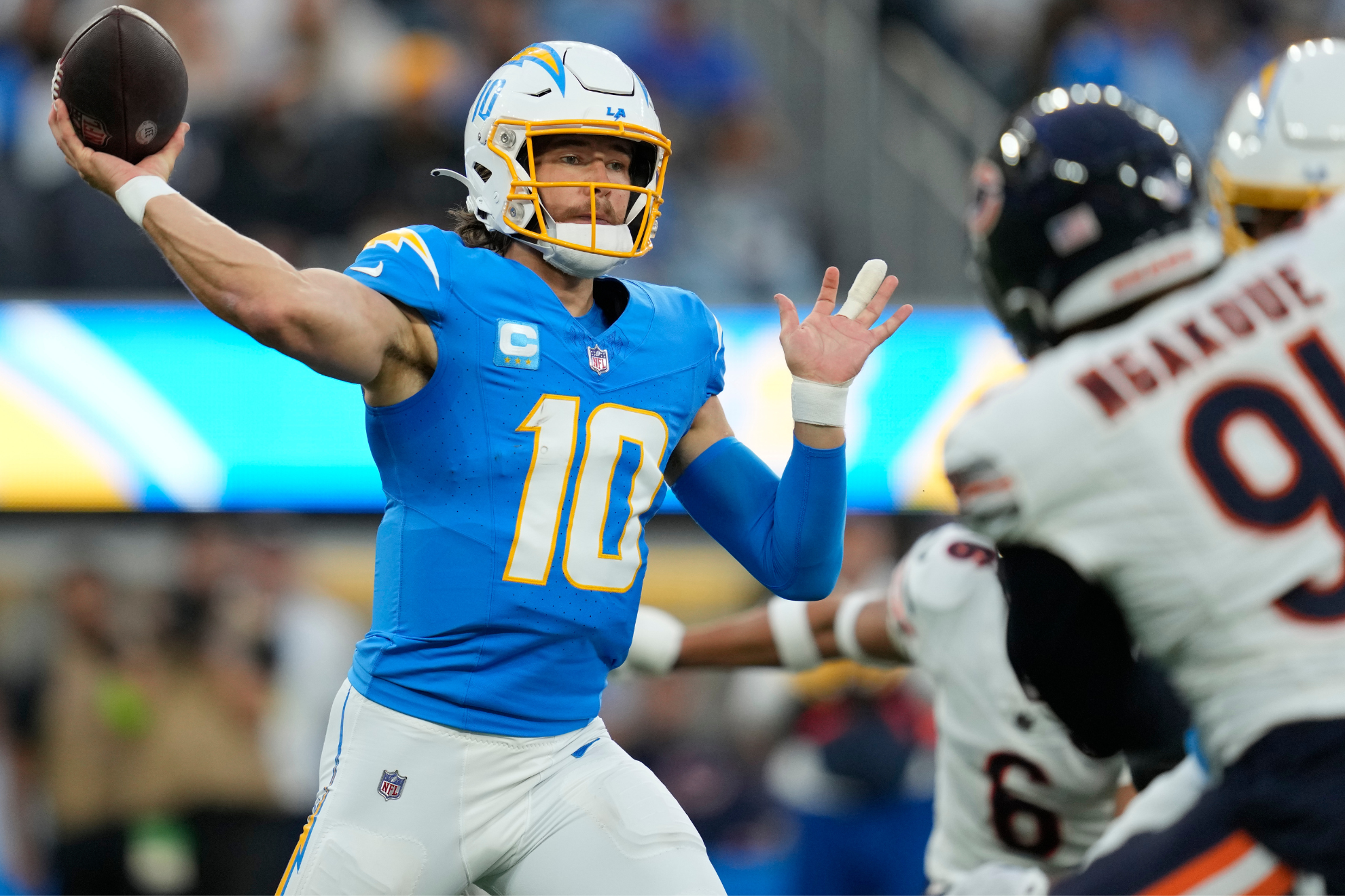 Justin Herbert threw for 298 yards against Chicagos defense.