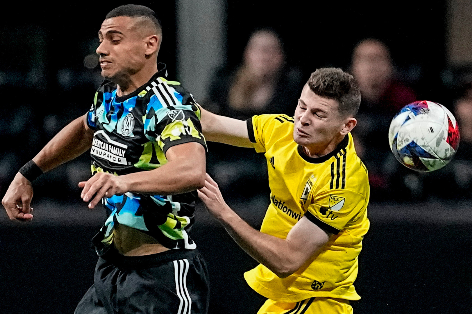 Playoff intensity: Giorgos Giakoumakis (left) and Sean Zawadzki (right) battle for the ball.