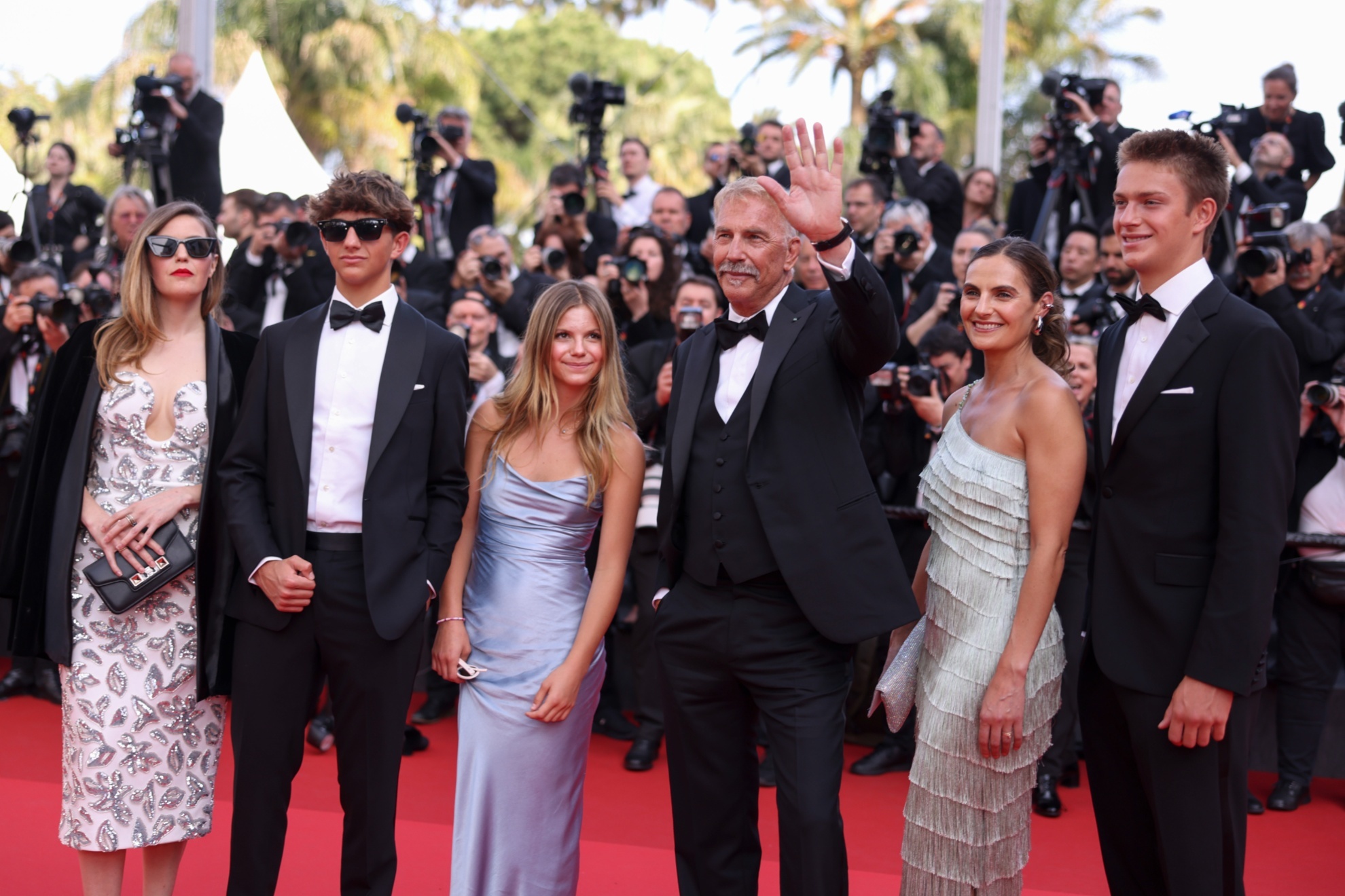 Lily Costner, from left, Hayes Costner, Grace Avery Costner, Kevin Costner, Cayden Wyatt Costner, and Annie Costner pose for photographers upon arrival at the premiere of the film Horizon: An American Saga at the 77th international film festival, Cannes, southern France, Sunday, May 19, 2024. (Photo by Vianney Le Caer/Invision/AP)