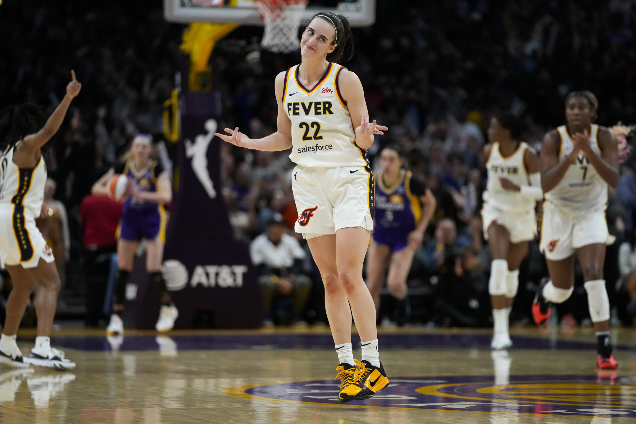 Caitlin Clark celebrates after scoring against the Los Angeles Sparks