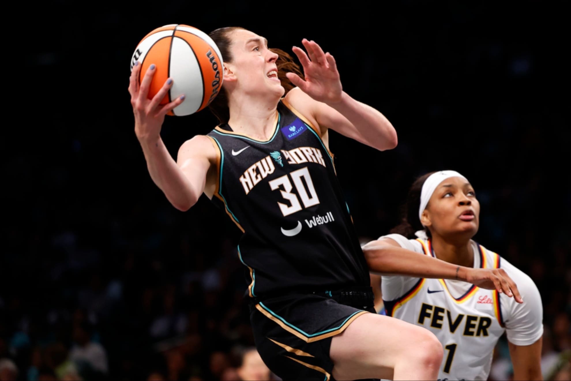 New York Liberty forward Breanna Stewart (30) goes to the basket past Indiana Fever forward NaLyssa Smith (1).