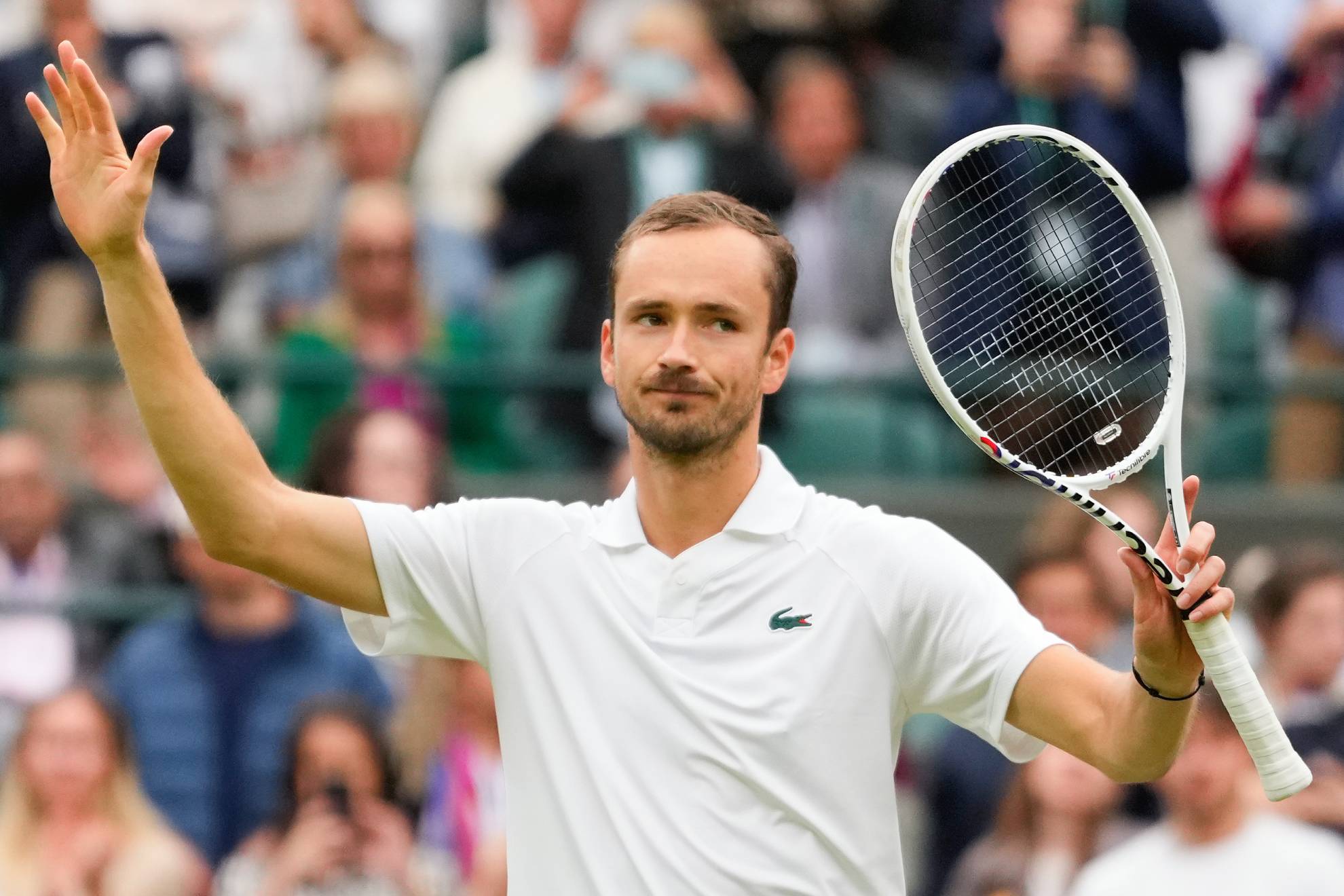 Daniil Medvedev of Russia reacts after Grigor Dimitrov of Bulgaria withdrew from their fourth round match injured at the Wimbledon tennis championships in London, Sunday, July 7, 2024.
