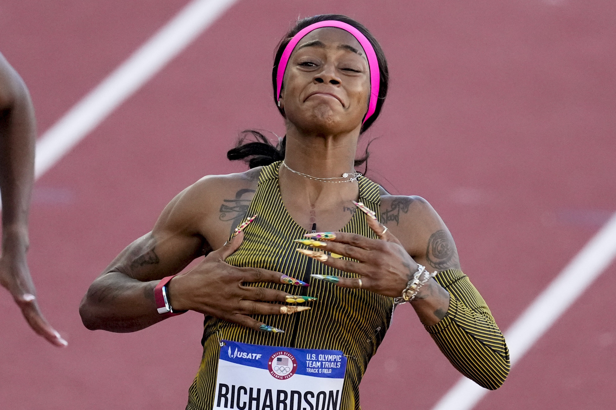 ShaCarri Richardson celebrates her win in the wins womens 100-meter run final during the U.S. Track and Field Olympic Team Trials.