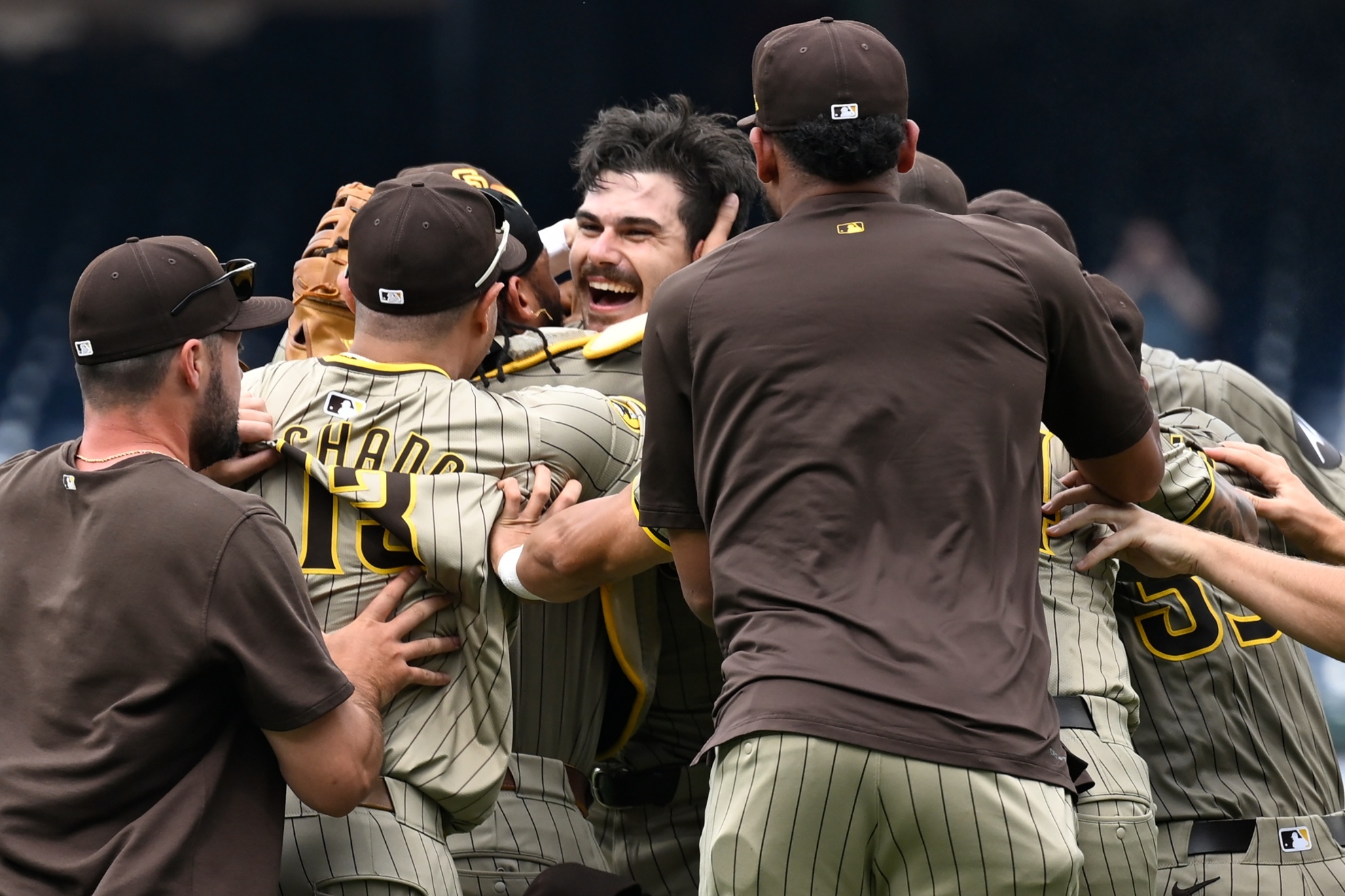 San Diego Padres team members join in the celebration for Padres starting pitcher Dylan Cease, center, for his no-hitter after nine complete innings of a baseball game against the Washington Nationals, Thursday, July 25, 2024, in Washington. (AP Photo/John McDonnell)