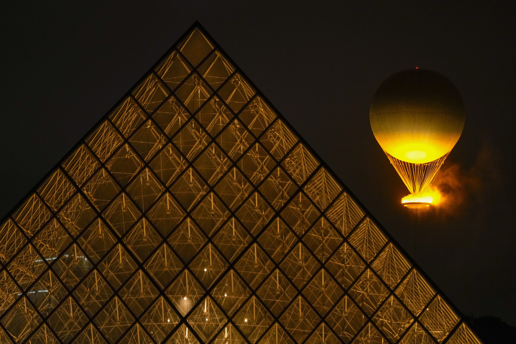 Olympic Flame rises balloon Louvre lit Paris France opening ceremony 2024 Summer Olympics Games