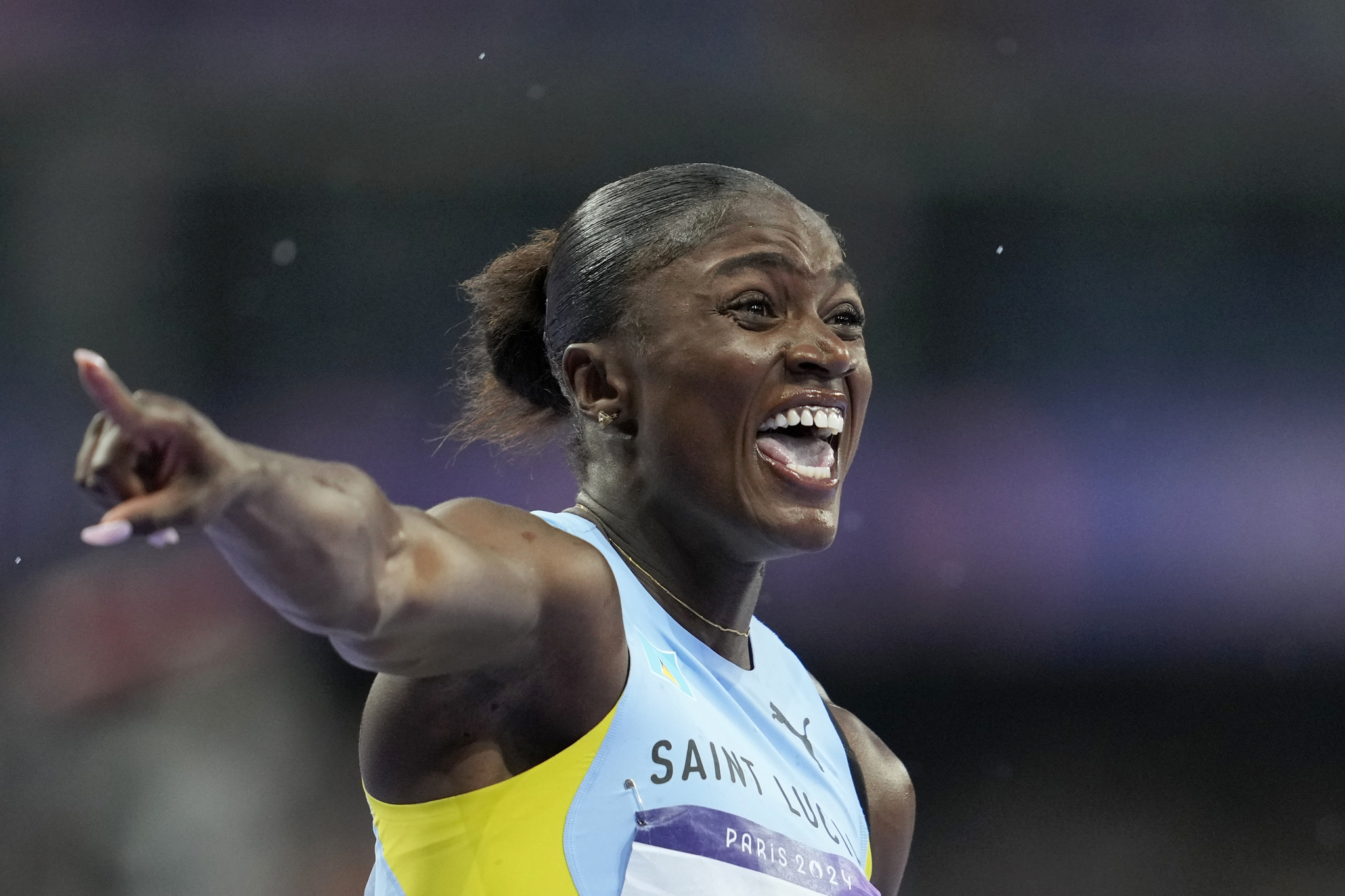 Julien Alfred of Saint Lucia, celebrates after winning the gold medal in the womens 100 meters final