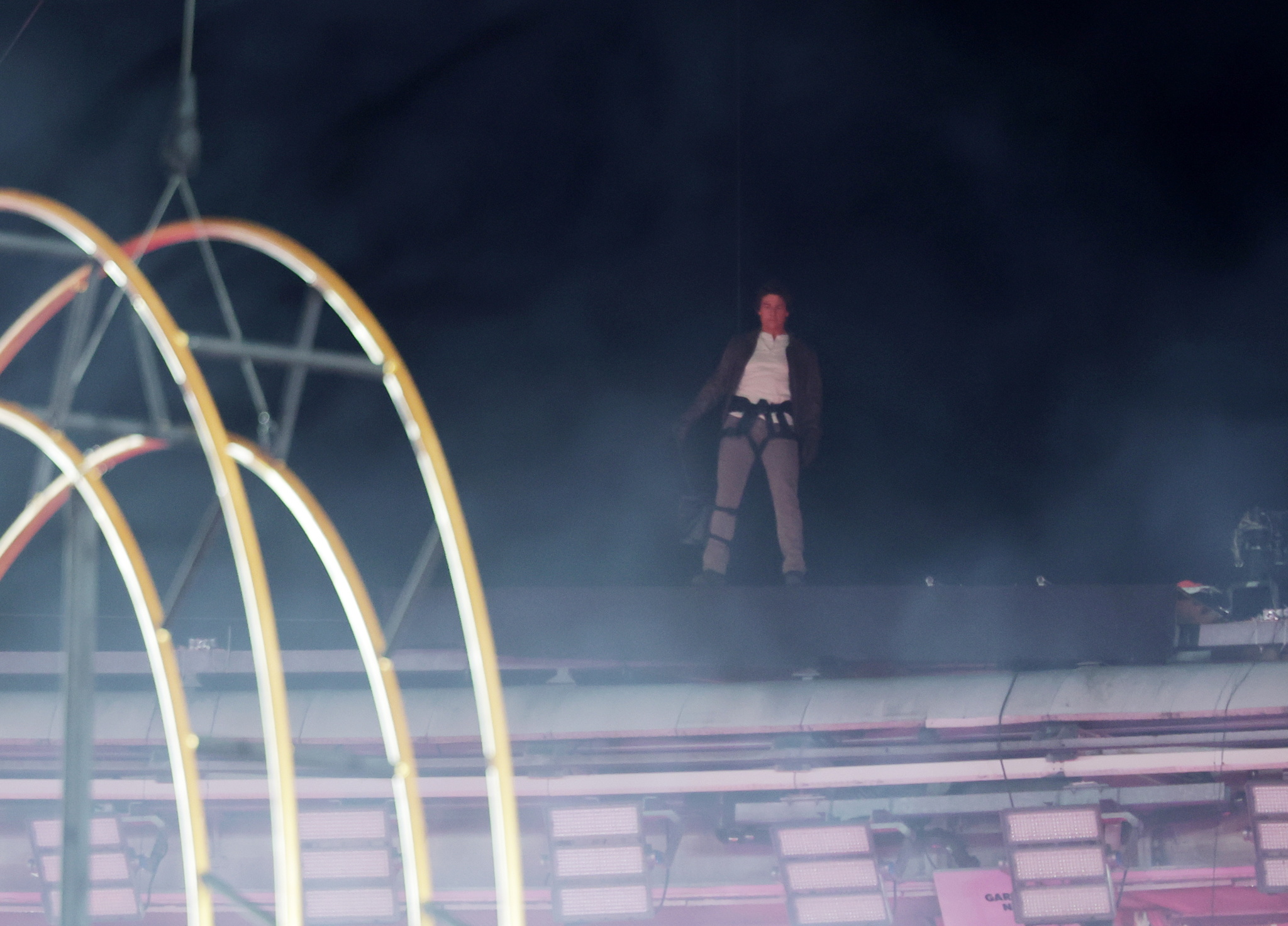 Tom Cruise performs a stunt during the Closing Ceremony of the Paris 2024 Olympic Games