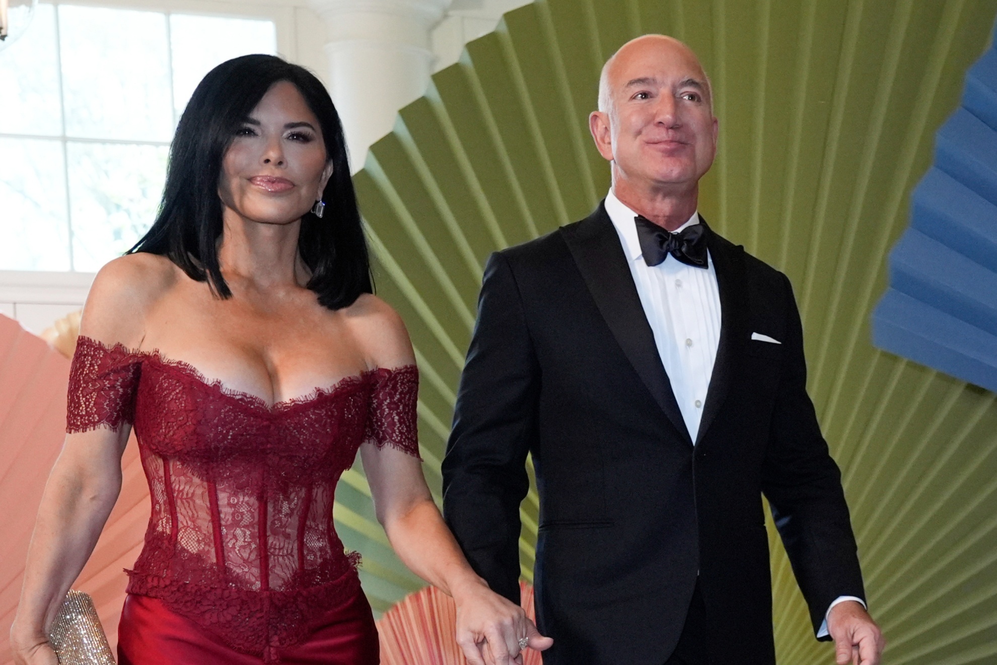 Jeff Bezos and Lauren S�nchez arrive at the Booksellers area of the White House for the State Dinner hosted by President Joe Biden and first lady Jill Biden for Japans Prime Minister Fumio Kishida, and wife Kishida Yuko, Wednesday, April 10, 2024, in Washington. (AP Photo/Jacquelyn Martin)