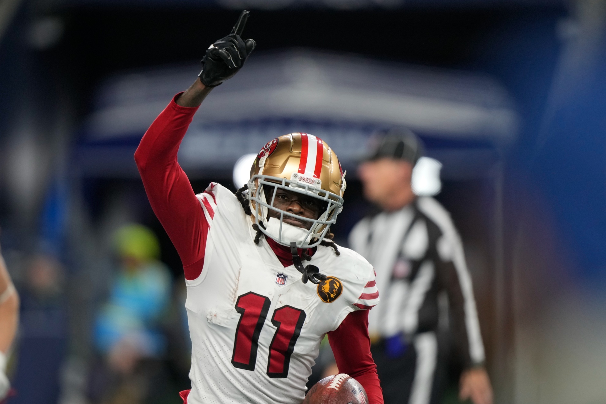San Francisco 49ers wide receiver Brandon Aiyuk runs back to the sideline after a 28-yard reception for a touchdown during the second half of an NFL football game against the Seattle Seahawks, Thursday, Nov. 23, 2023, in Seattle. (AP Photo/Stephen Brashear)