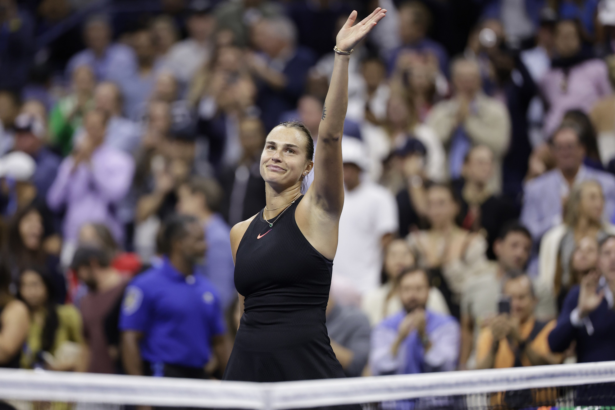 Aryna Sabalenka, of Belarus, waves after defeating Zheng Qinwen, of China, during the quarterfinals of the U.S. Open