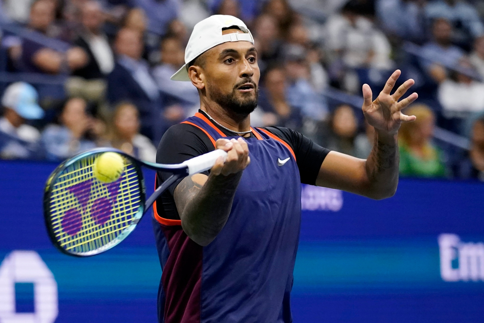 Nick Kyrgios, of Australia, returns to Karen Khachanov, of Russia, during the quarterfinals of the U.S. Open tennis championships