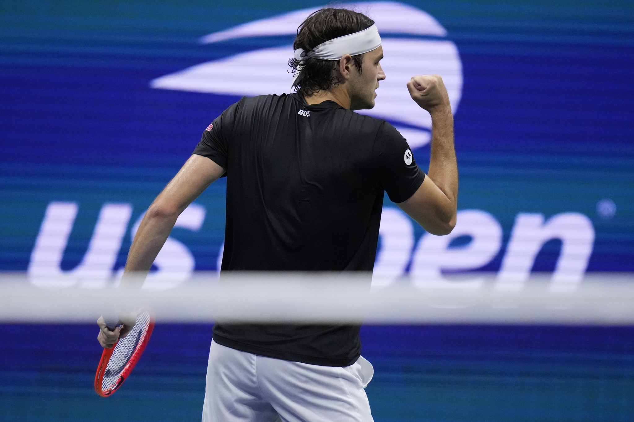 Taylor Fritz, of the United States, reacts against Frances Tiafoe, of the United States, during the lt;HIT gt;men lt;/HIT gt;s singles semifinals of the lt;HIT gt;U.S lt;/HIT gt;. lt;HIT gt;Open lt;/HIT gt; tennis championships, Friday, Sept. 6, 2024, in New York. (AP Photo/Kirsty Wigglesworth)