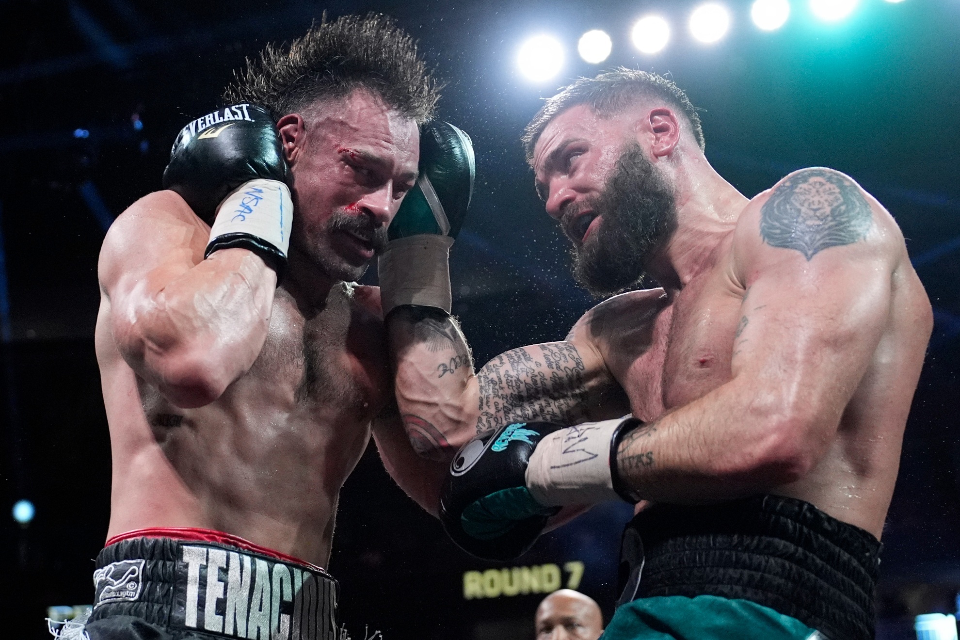 Caleb Plant, right, hits Trevor McCumby in an interim super middleweight title bout Saturday, Sept. 14, 2024, in Las Vegas. (AP Photo/John Locher)