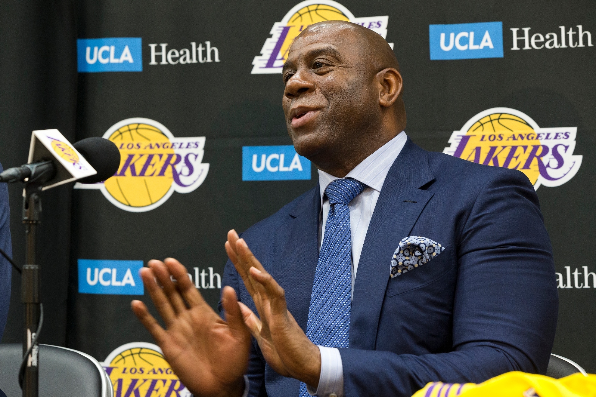 Los Angeles Lakers president of basketball operations, Earvin Magic Johnson, takes questions from the media as he introduces the NBA teams draft picks in El Segundo, Calif., Tuesday, June 26, 2018. Magic Johnson is betting his job on his free-agent recruiting skills for the Los Angeles Lakers. Johnson says he will step down as the Lakers president of basketball operations if he cant persuade an elite free agent to sign with his club within the next two summers.