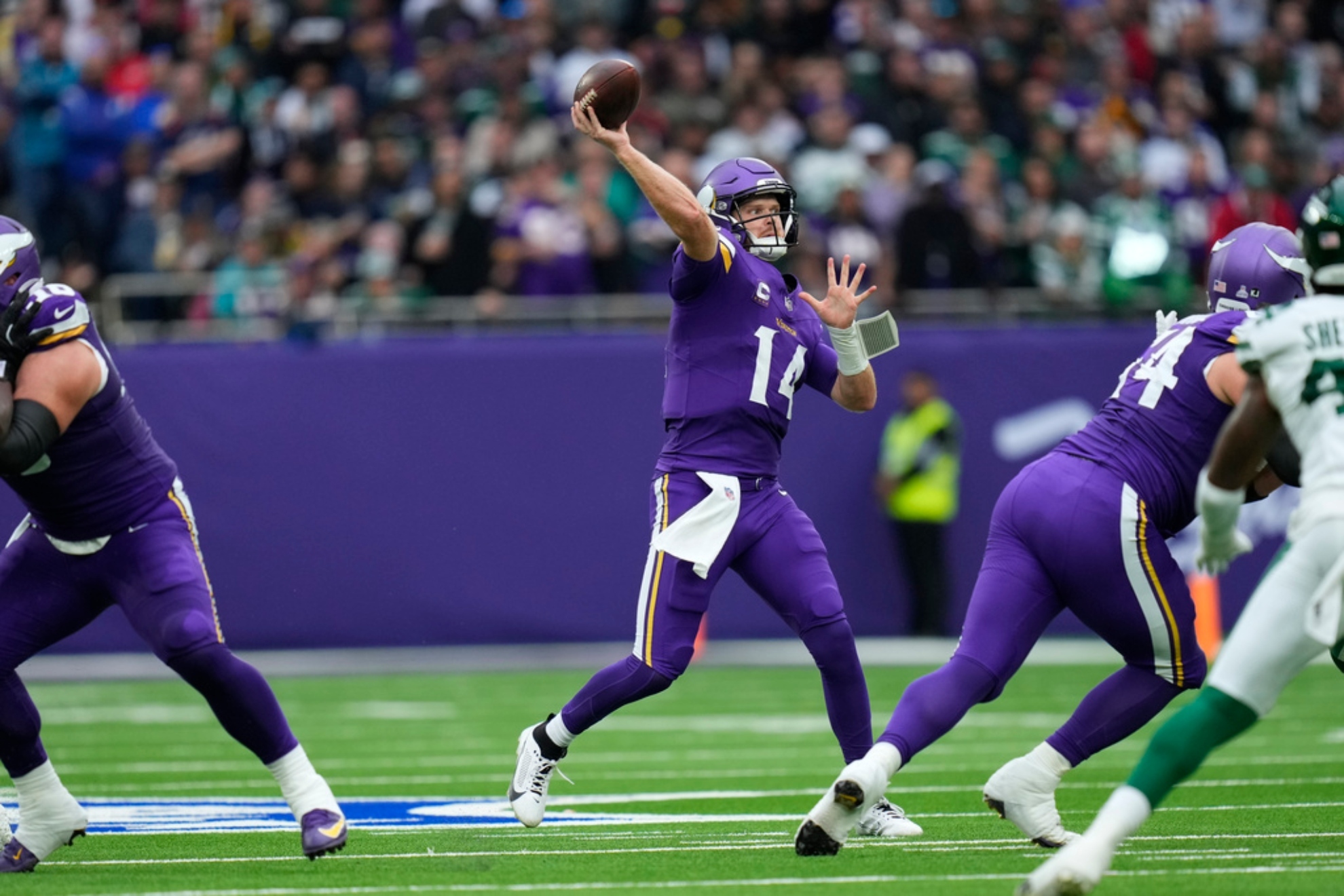 Vikins Sam Darnold throws during the first half of an NFL football game against the New York Jets.