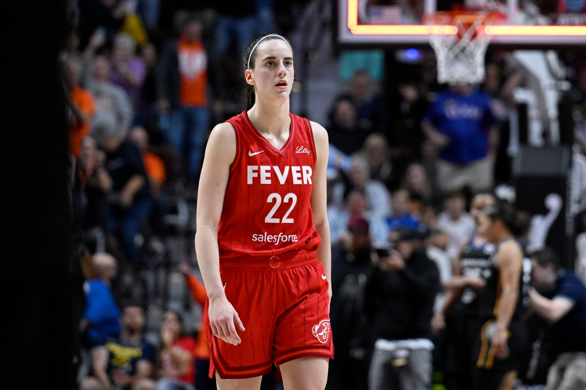 Caitlin Clark walks off the court after the Fever were eliminated by the Connecticut Sun in an WNBA basketball playoff game