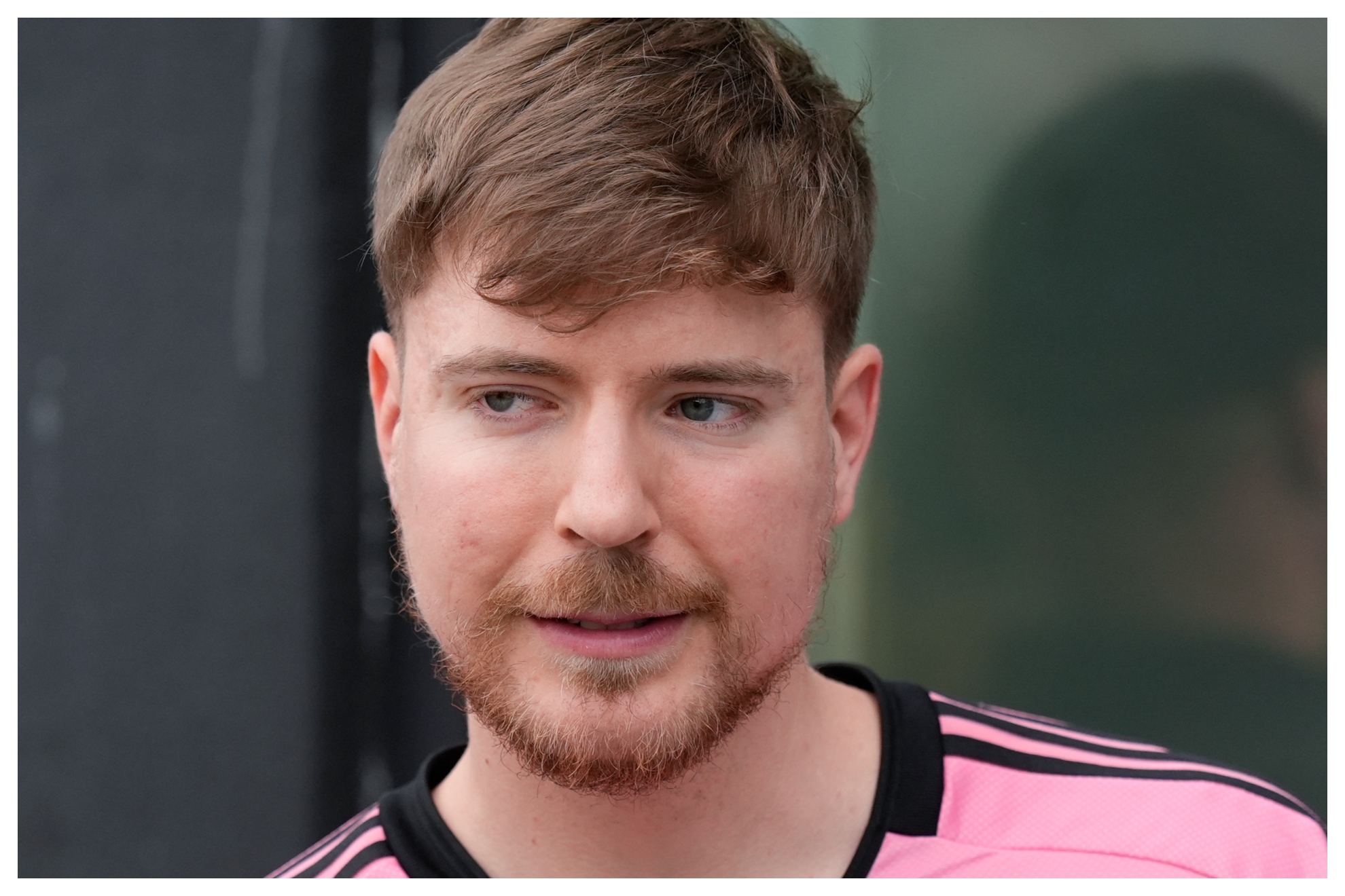 Jimmy Donaldson, the popular YouTube video maker who goes by MrBeast, wears a Lionel Messi jersey as he stands in a sideline box at the start of an MLS soccer match between Inter Miami and CF Montreal Sunday, March 10, 2024, in Fort Lauderdale, Fla.