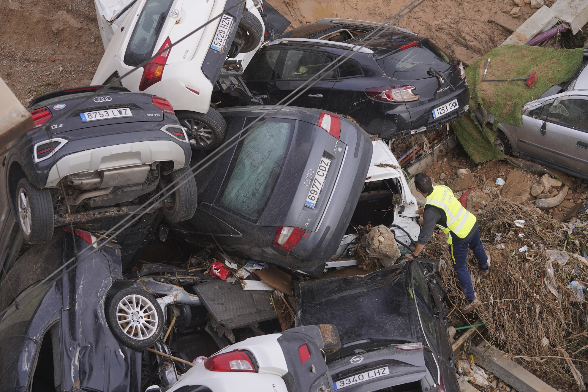Spain Floods 205 bodies victims killed guard survivors cars piled Valencia Spain