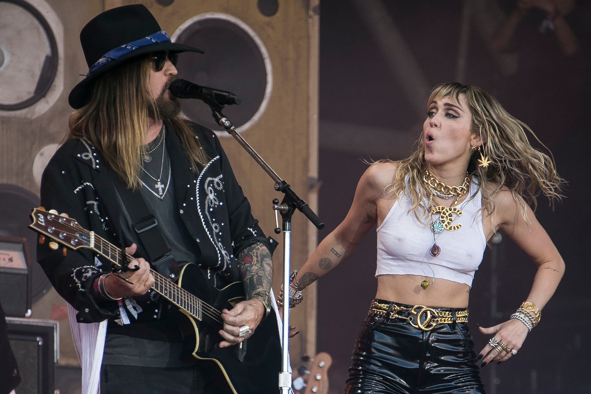 Singers Miley Cyrus, right, and her father Billy Ray Cyrus perform on the final day of Glastonbury Festival at Worthy Farm, Somerset, England, Sunday, June 30, 2019.