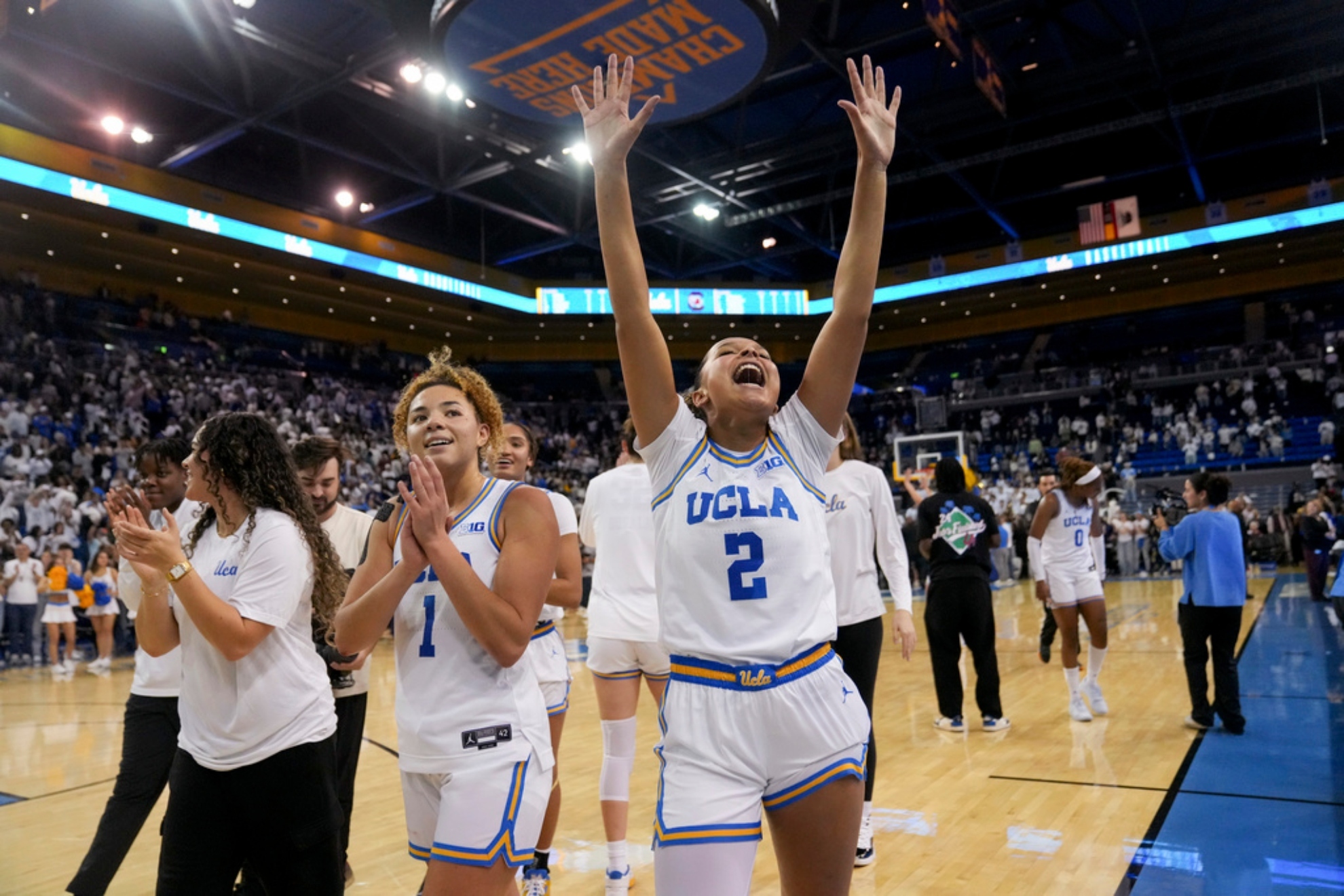UCLA guards Kiki Rice (1) and Avary Cain (2) celebrate after an NCAA college basketball game against South Carolina.
