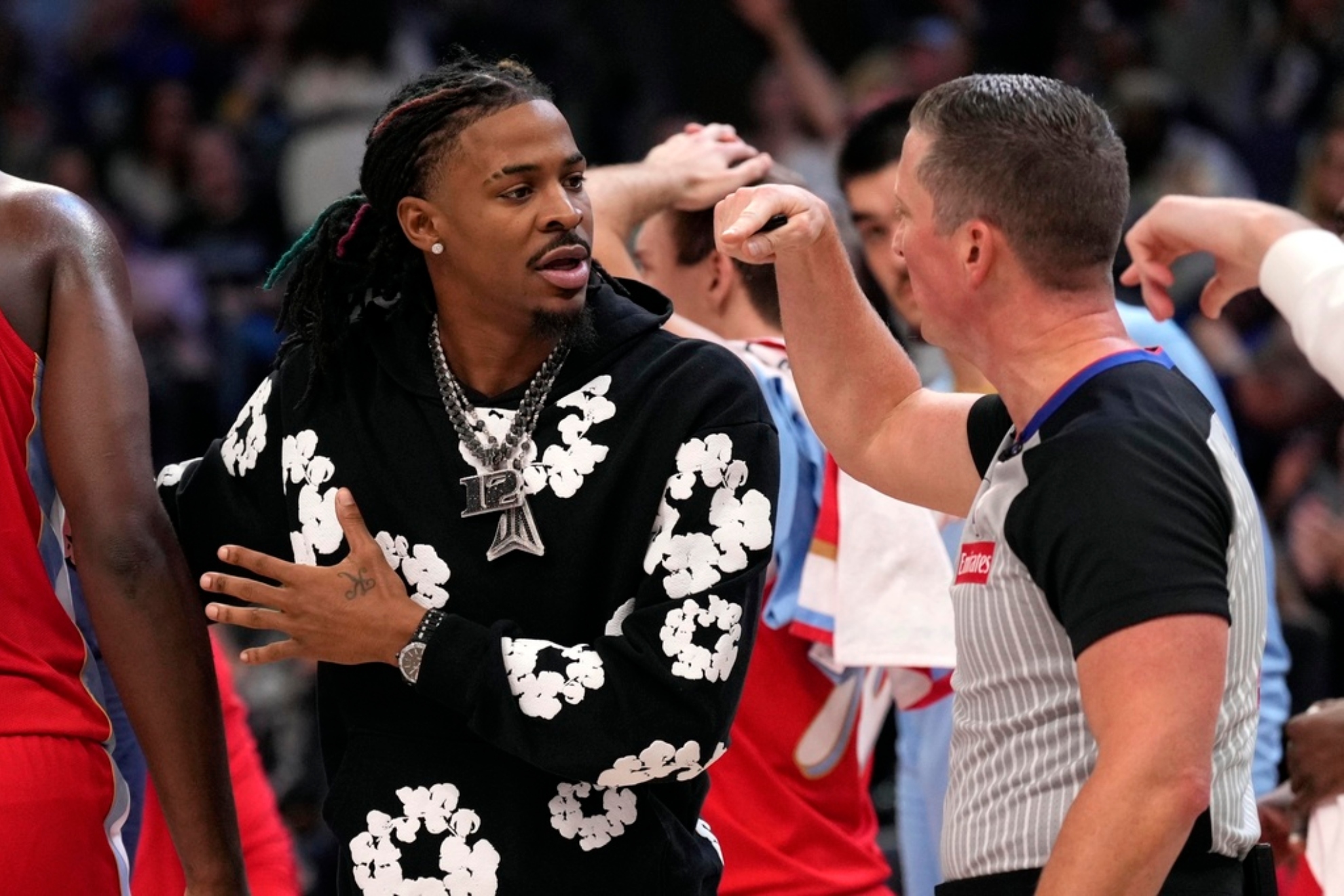 Ja Morant protests to a referee