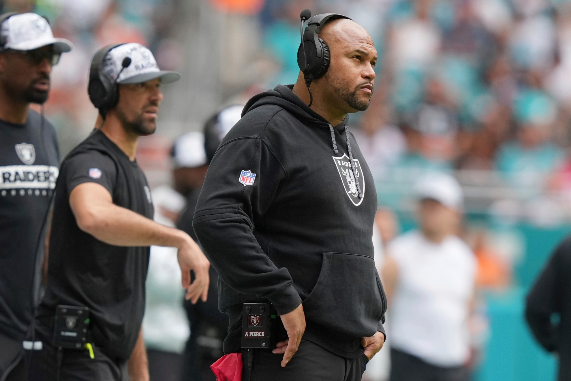 Las Vegas Raiders head coach Antonio Pierce watches from the sidelines during the first half of an NFL football game against the Miami Dolphins, Sunday, Nov. 17, 2024, in Miami Gardens, Fla. (AP Photo/Lynne Sladky)