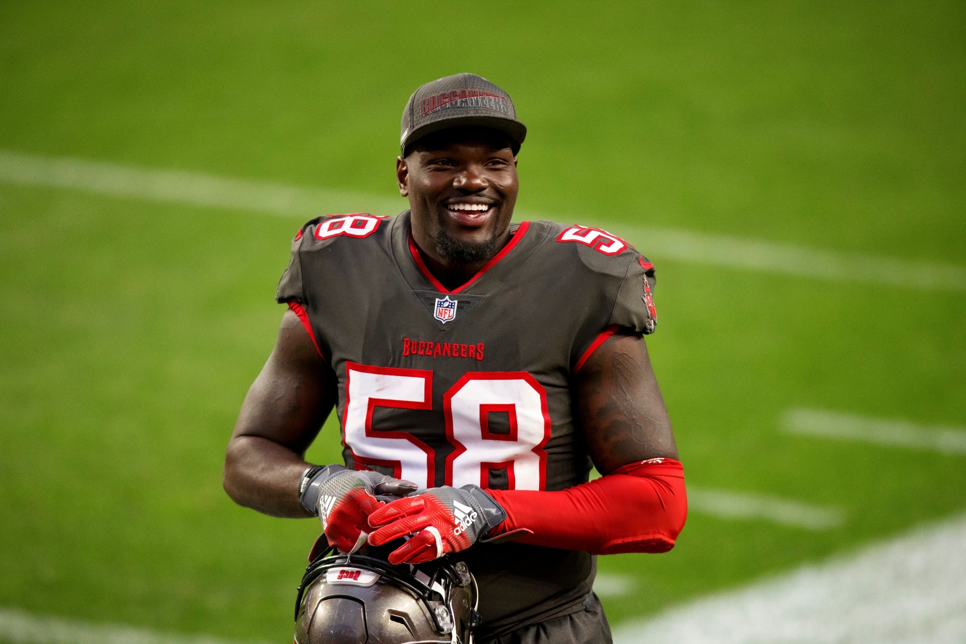 Tampa Bay Buccaneers linebacker Shaquil Barrett (58) smiles while running off the field after defeating the Denver Broncos in an NFL football game, Sunday, Sept.. 27, 2020, in Denver.