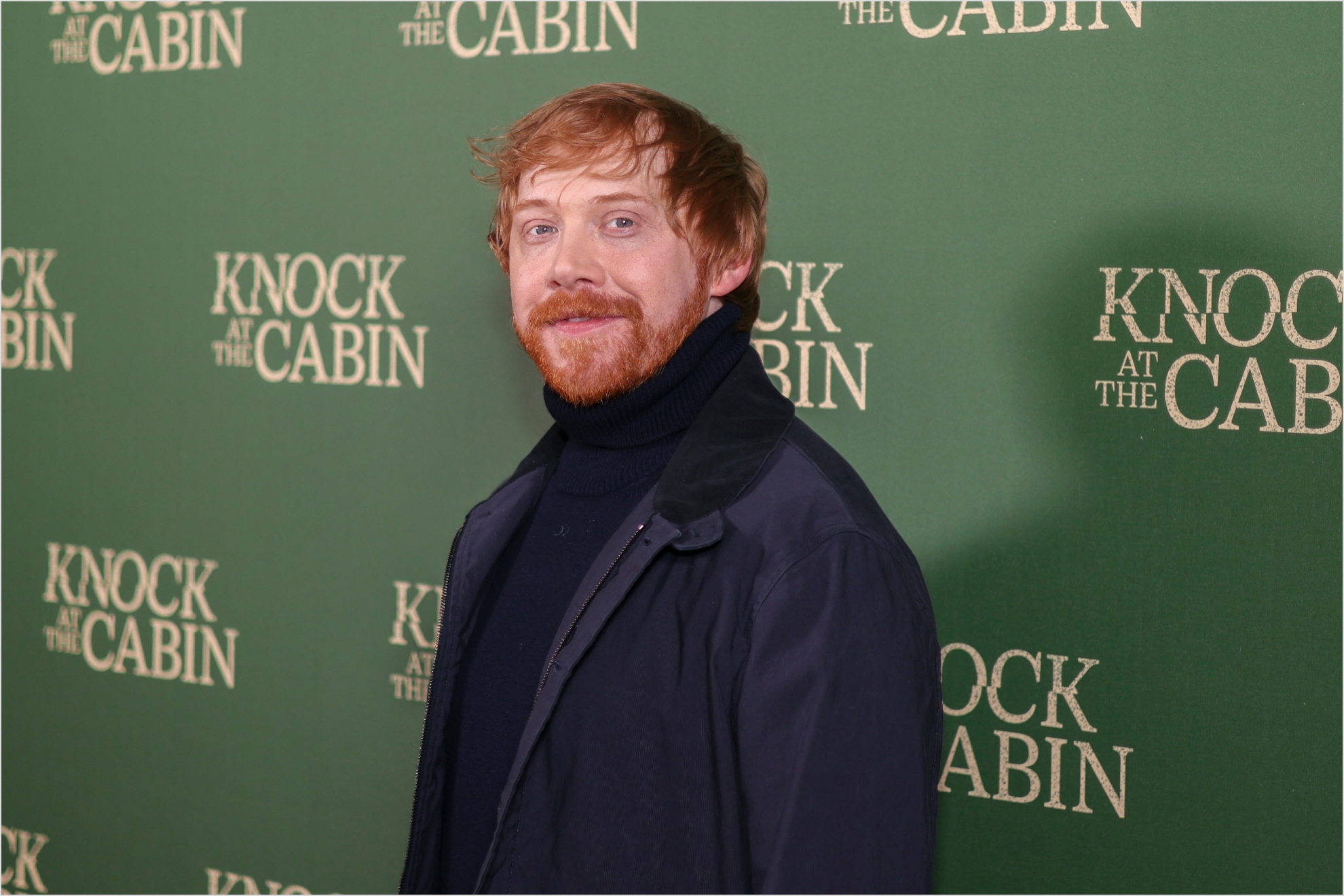 Rupert Grint poses for photographers upon arrival at the special screening of the film Knock at the Cabin in London, Wednesday, Jan. 25, 2023
