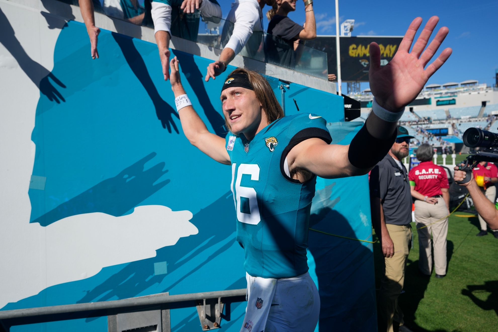 Jacksonville Jaguars quarterback Trevor Lawrence (16) waves to fans as he leaves the field after an NFL football game against the Indianapolis Colts, Sunday, Oct. 15, 2023, in Jacksonville, Fla.