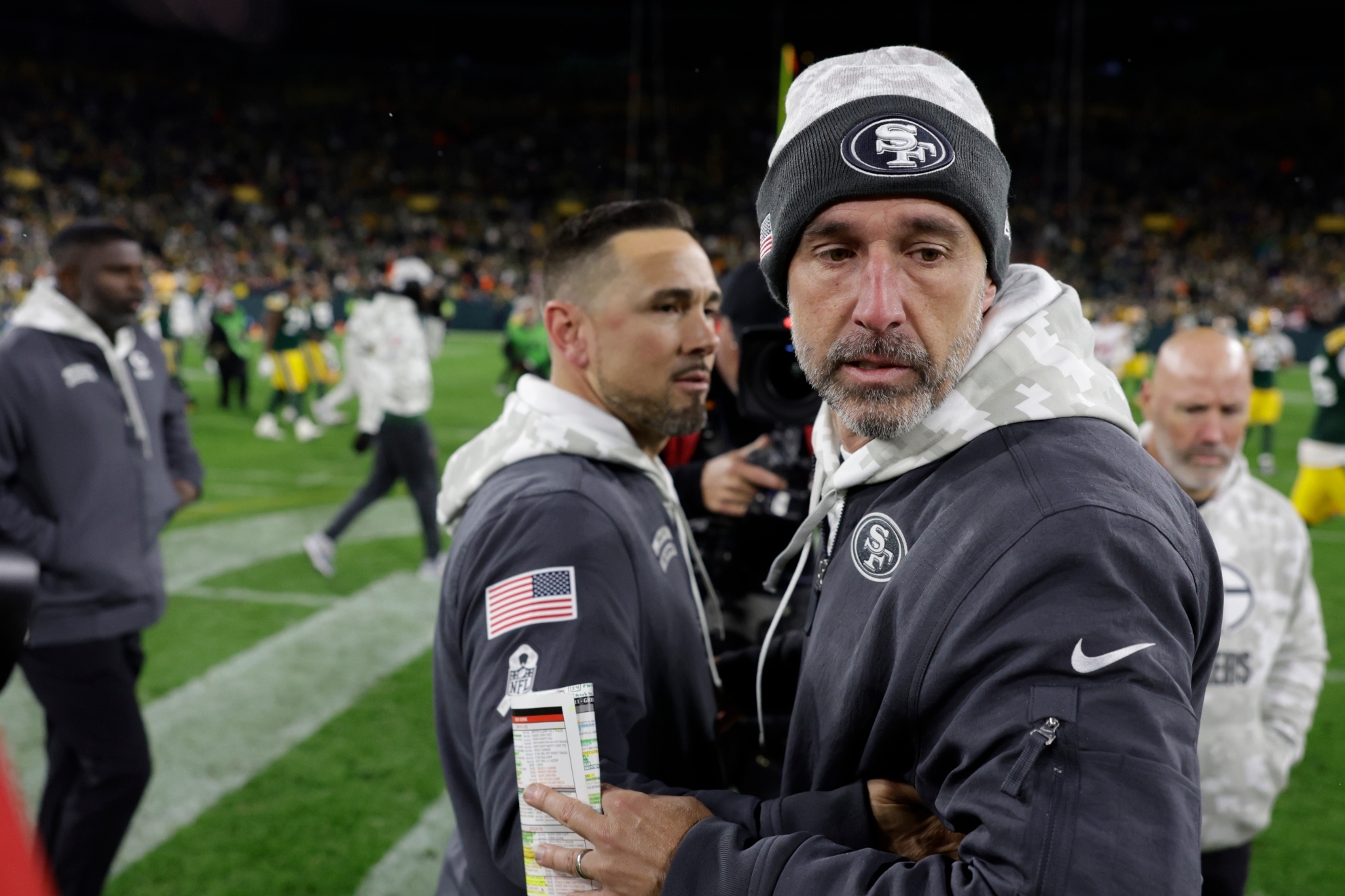Green Bay Packers head coach Matt LaFleur, left, and San Francisco 49ers head coach Kyle Shanahan meet after an NFL football game on Sunday, Nov. 24, 2024 in Green Bay, Wis.