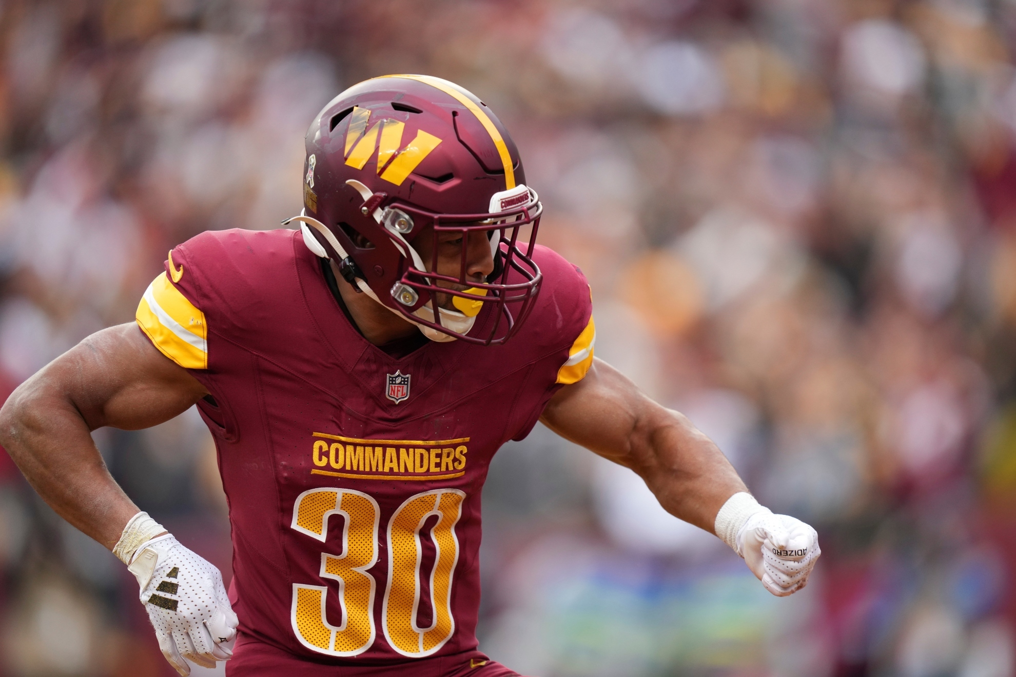 Washington Commanders running back Austin Ekeler reacts after his 1-yard rushing touchdown during the first half of an NFL football game against the Pittsburgh Steelers, Sunday, Nov. 10, 2024, in Landover, Md. (AP Photo/Stephanie Scarbrough)