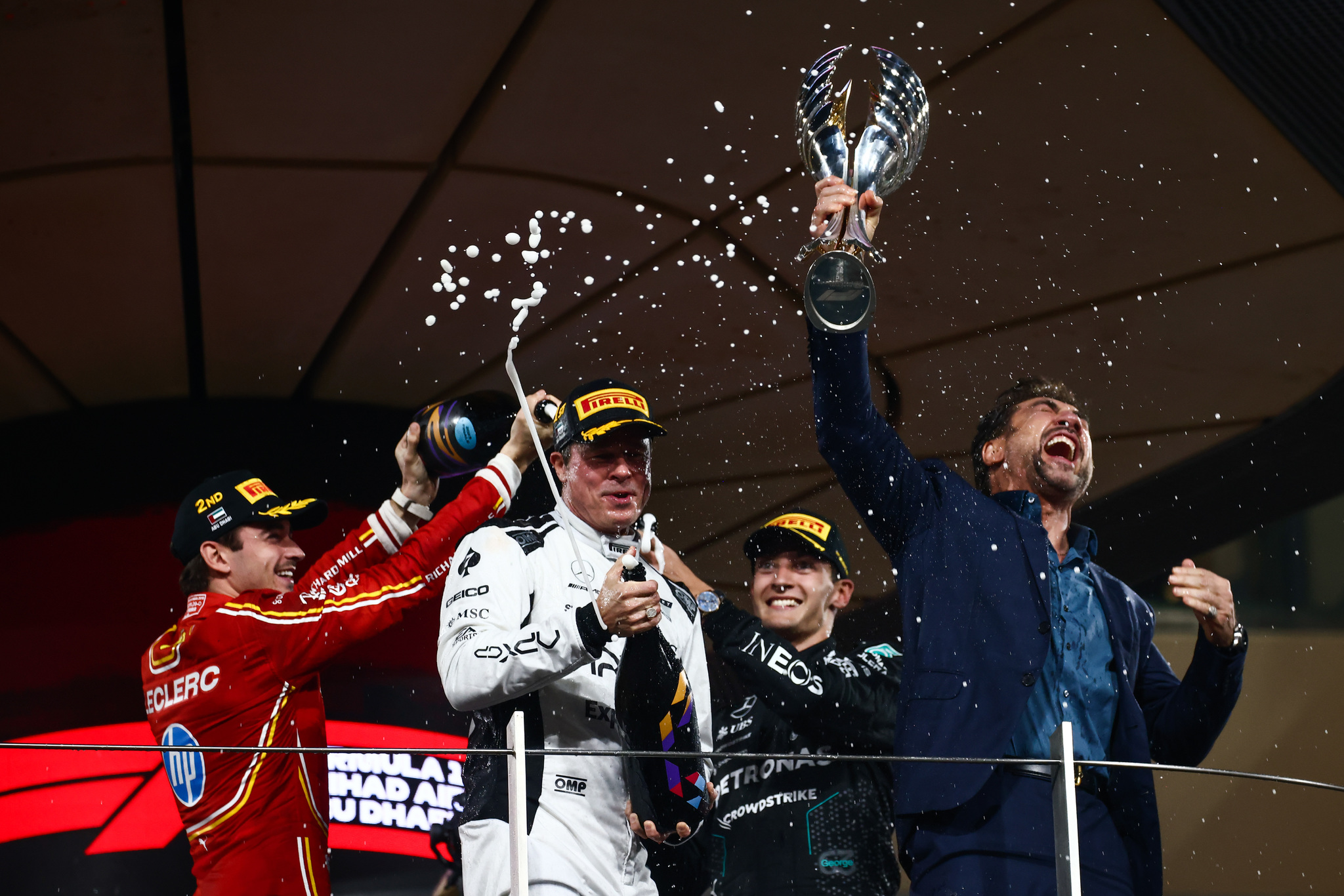 Brad Pitt shares Formula 1 podium with Charles Leclerc and George Russell