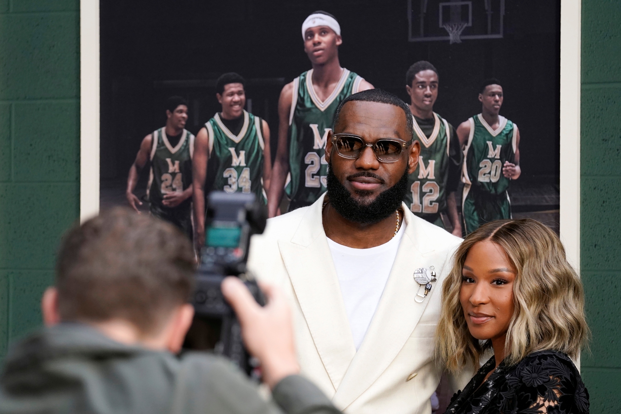NBA basketball player LeBron James and his wife Savannah pose for a photo at the premiere of the Peacock film Shooting Stars, Wednesday, May 31, 2023, at the Regency Village Theatre in Los Angeles. The film chronicles the high school basketball years of James and his childhood friends at St. Vincent-St. Mary High School in Akron, Ohio.