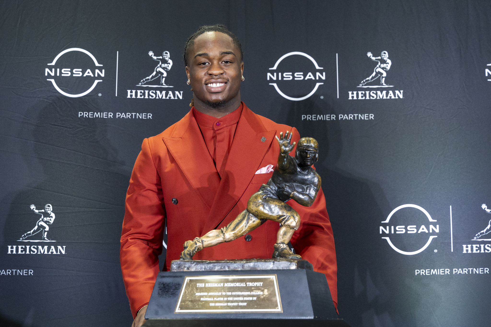 Heisman Trophy finalist  lt;HIT gt;Ashton lt;/HIT gt;  lt;HIT gt;Jeanty lt;/HIT gt;, of Boise State, stands with the trophy during a college football press conference, Saturday, Dec. 14, 2024, in New York. (AP Photo/Corey Sipkin)