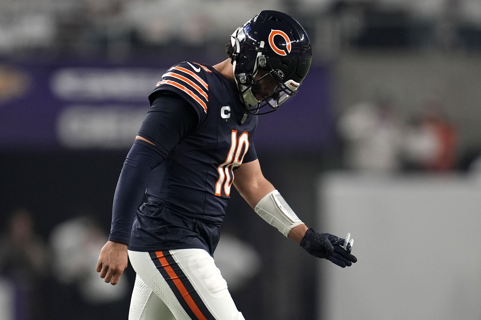 Chicago Bears quarterback Caleb Williams walks off the field after an incomplete