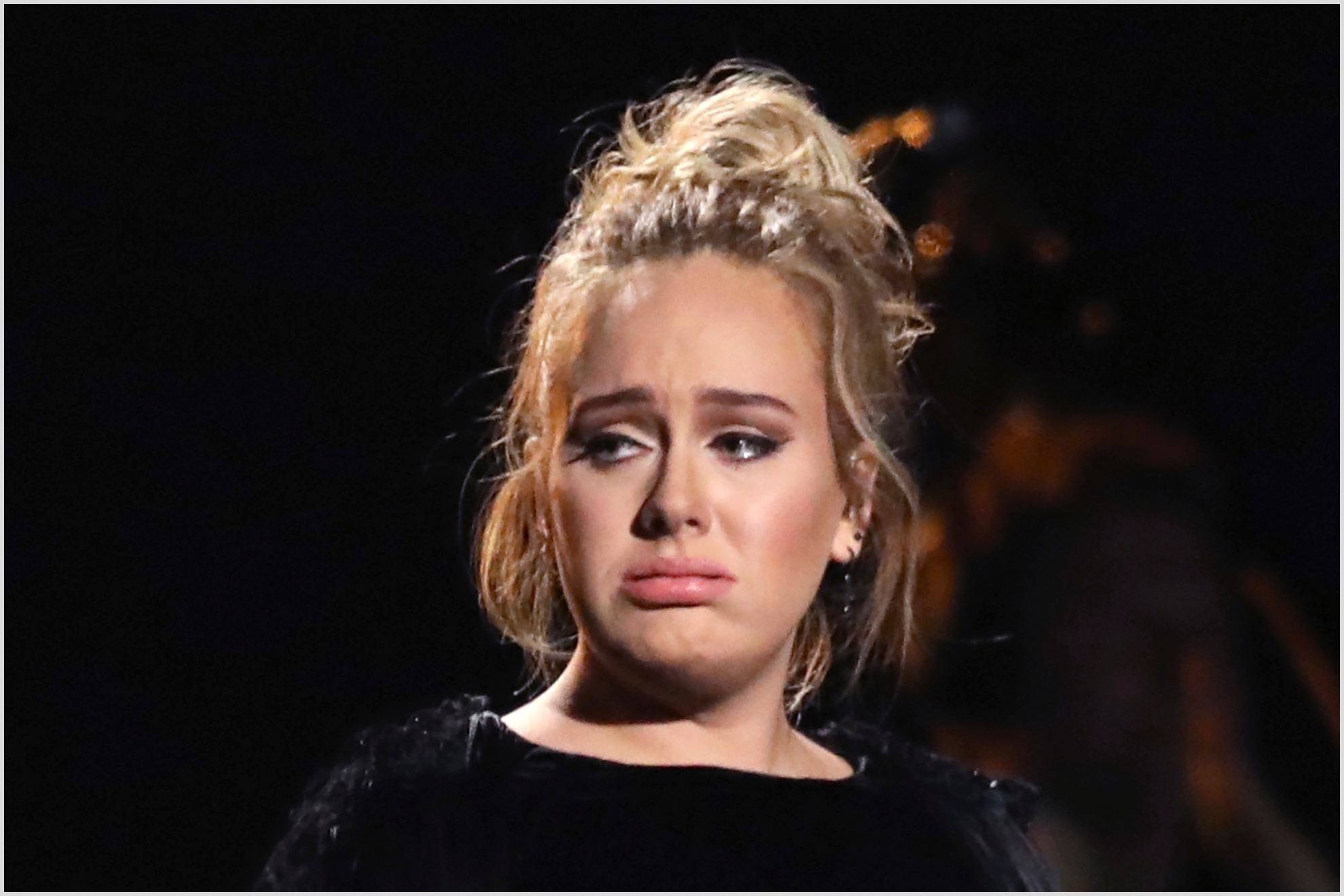 Adele reacts after concluding a performance tribute to George Michael at the 59th annual Grammy Awards on Sunday, Feb. 12, 2017, in Los Angeles.