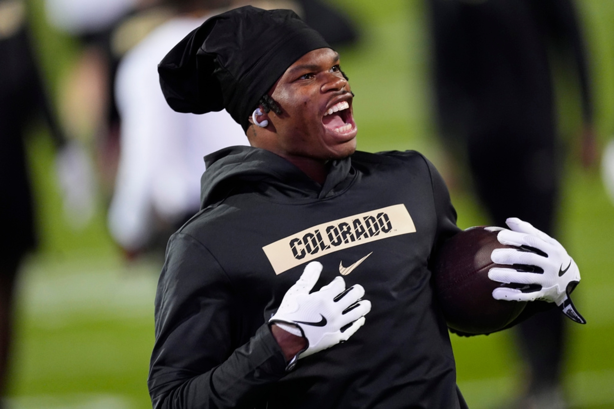 Colorado wide receiver Travis Hunter (12) warms up before an NCAA college football.