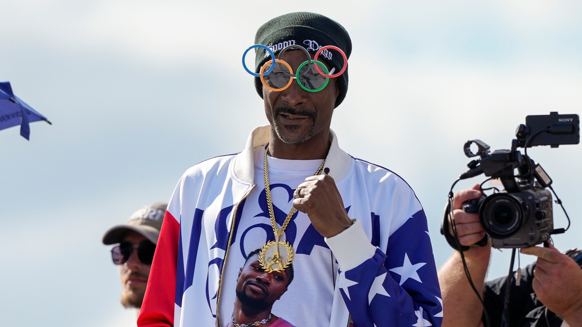 US artist Snoop Dogg gestures during the mens skateboarding park finals at the 2024 Summer Olympics, Wednesday, Aug. 7, 2024, in Paris, France