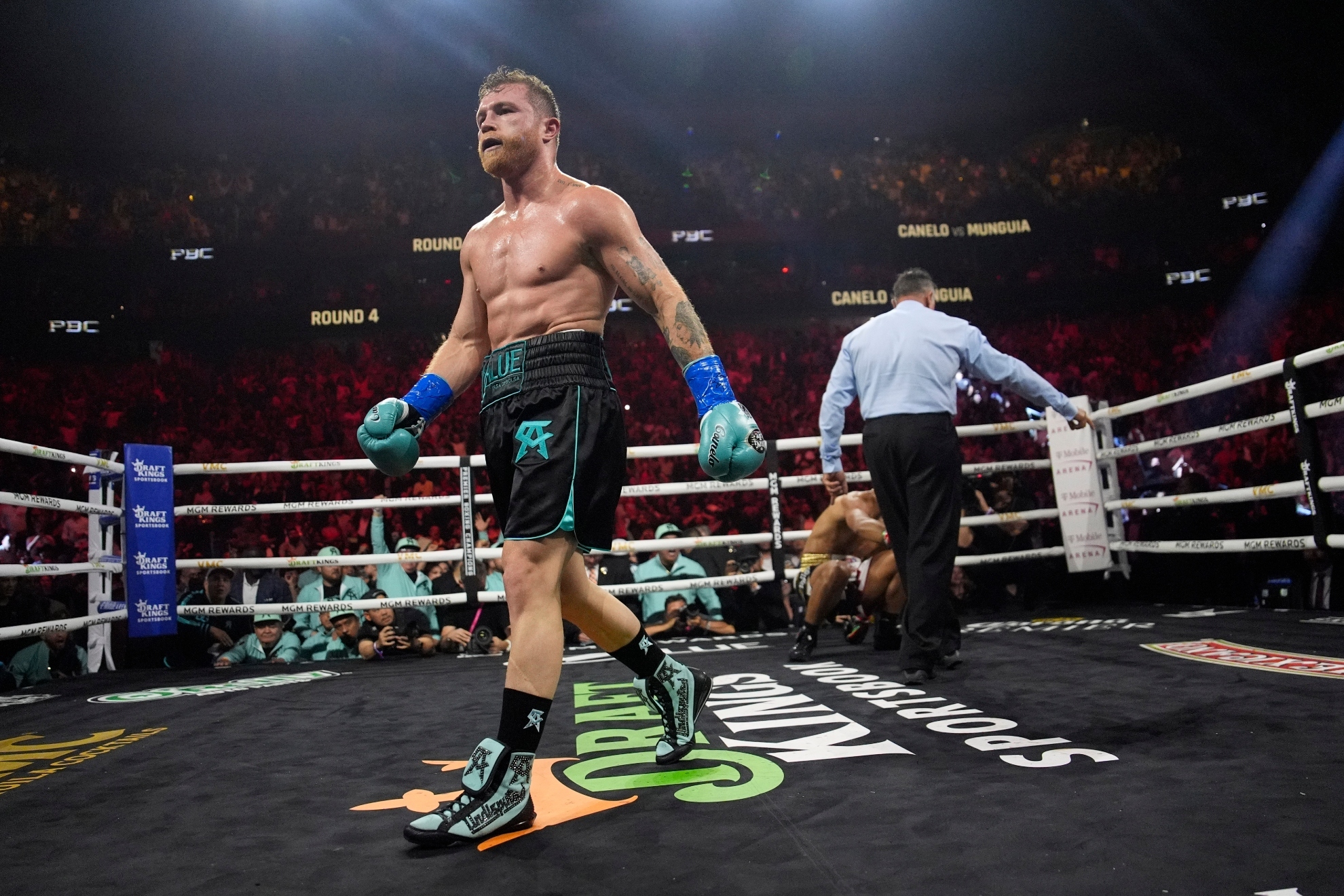 Canelo Alvarez knocks down Jaime Munguia in a super middleweight title fight Saturday, May 4, 2024, in Las Vegas.
